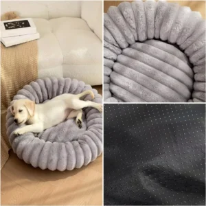 Cat curled up sleeping in super soft long plush round pet bed with raised rim for security