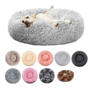 Small dog curled up sleeping in round plush pet bed with raised rim